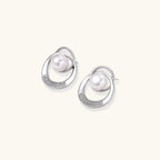 White gold-plated brass earrings with circular design, freshwater pearl center, and diamond accents