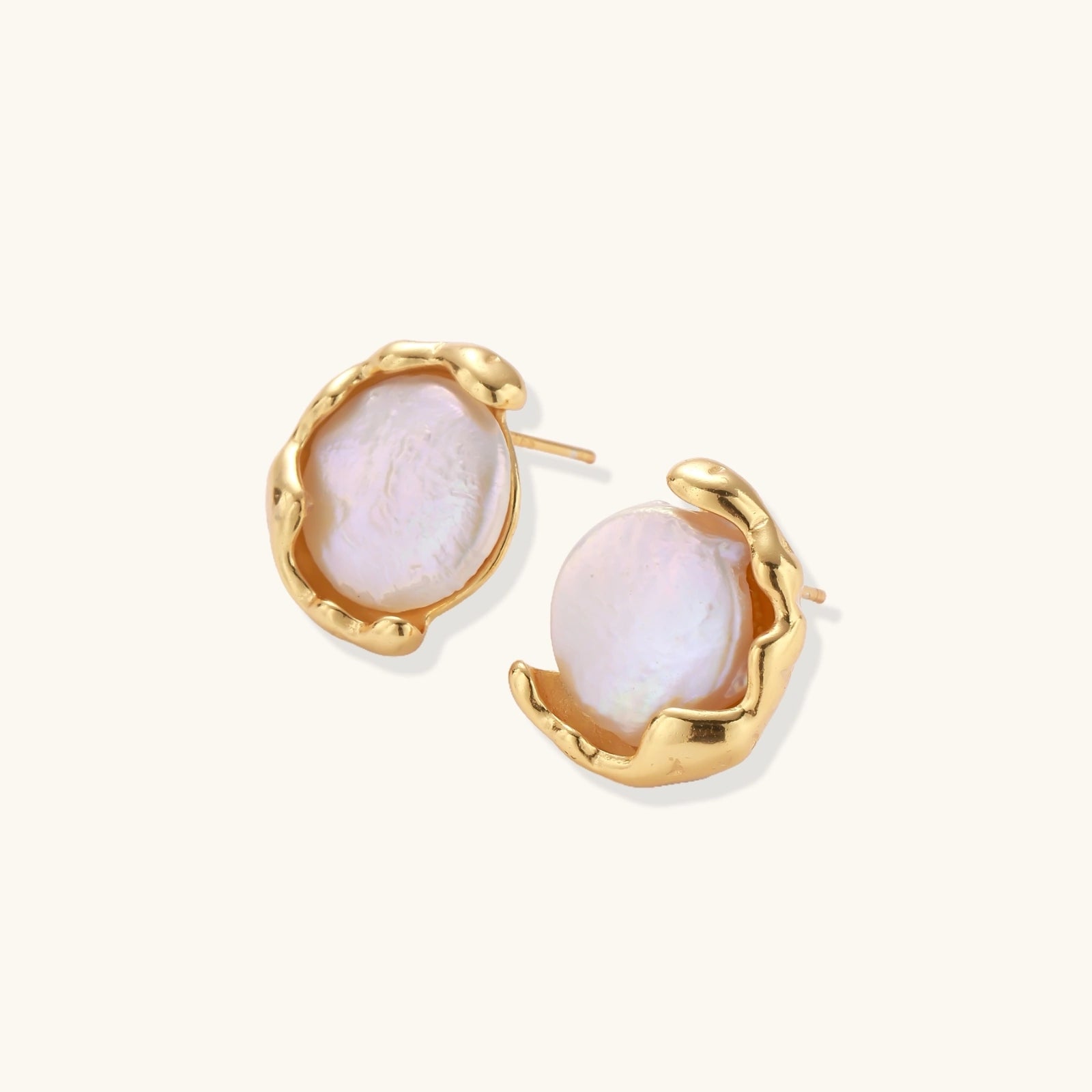 Gold vermeil studs with lustrous pink freshwater pearls in organic crescent settings