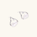Silver mountain outline studs with baroque pearl and diamond accent on white background