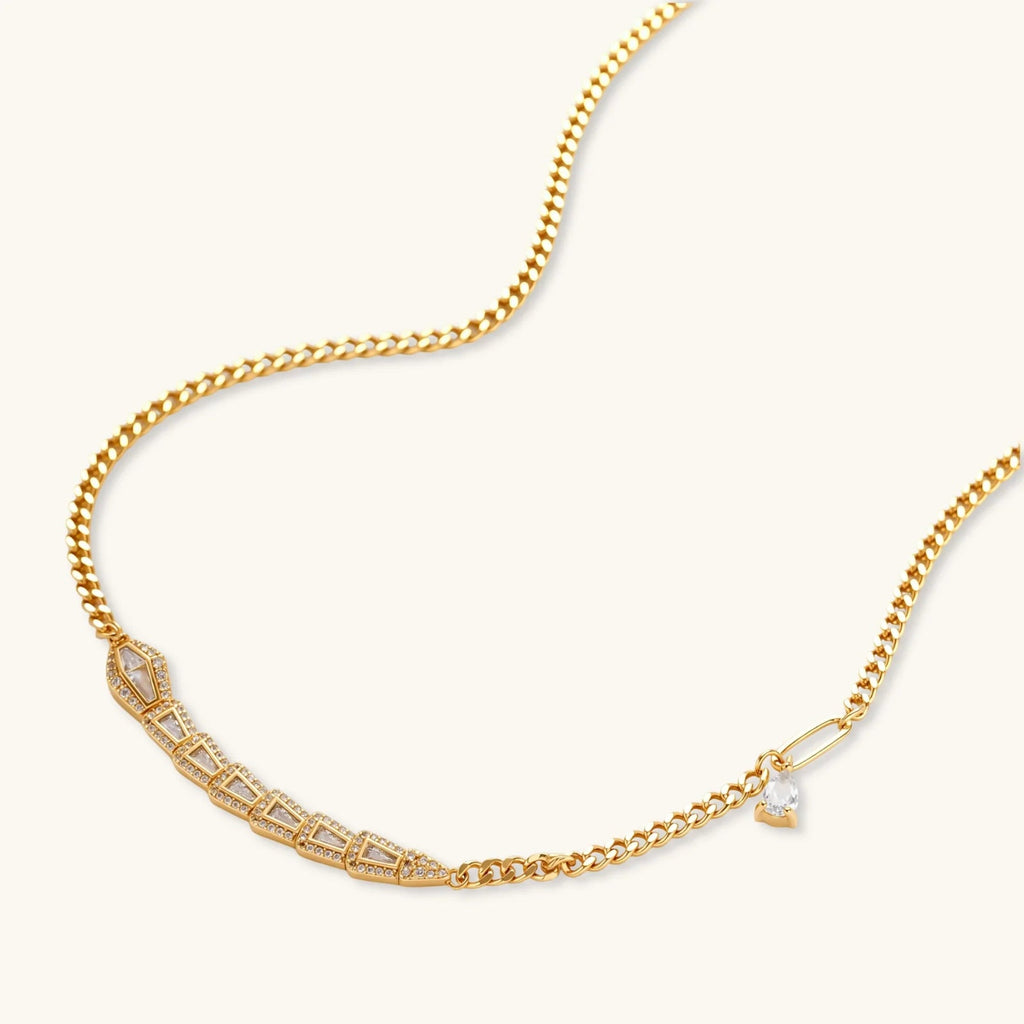 Gold-plated necklace with geometric diamond segments and matching huggie earrings featuring cubic zirconia details
