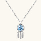Sterling silver dreamcatcher pendant with blue moissanite center and three feather charms on adjustable chain.