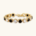 Gold-plated jewelry set with alternating black and clear cubic zirconia stones, featuring necklace, earrings and bracelet