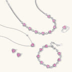 Pink heart-shaped cubic zirconia jewelry set with white gold plating featuring necklace, earrings, bracelet and ring