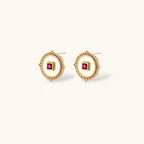 Gold-plated circular medallion necklace set with white enamel base and pink cubic zirconia accent stones